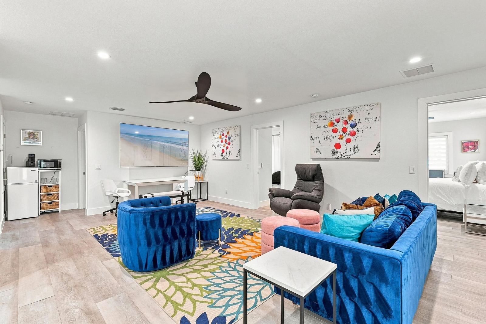 Colorful second-floor lounge with velvet sofas