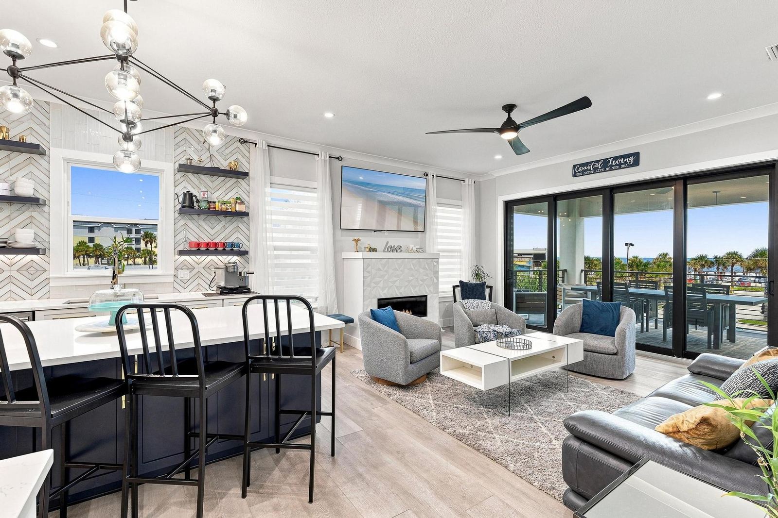 Open kitchen and family room with sliders to the balcony