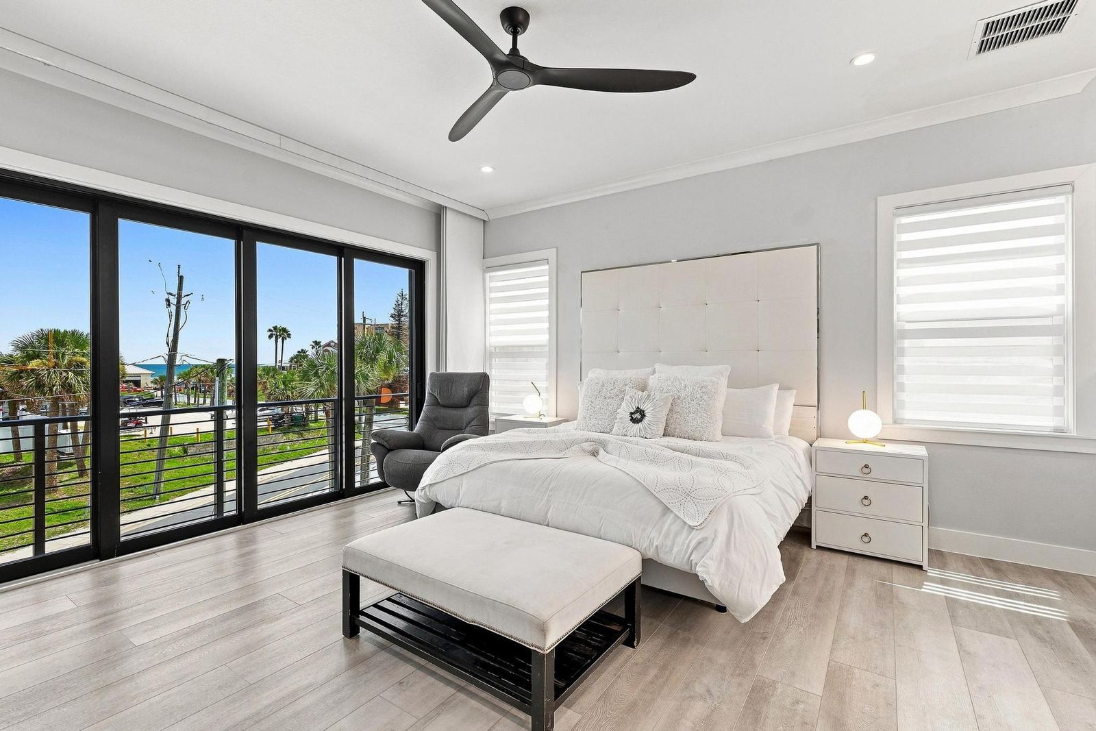 King primary bedroom with sliders to the balcony